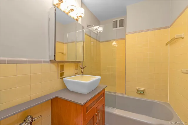 a bathroom with a sink and a bathtub