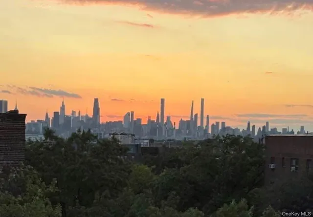 a view of a city with tall buildings in the background