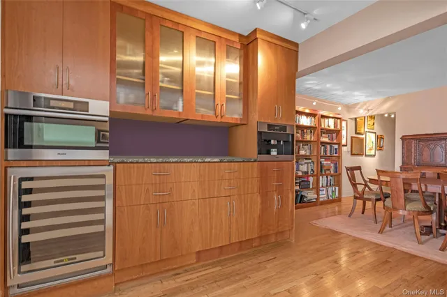 a view of kitchen with furniture and windows