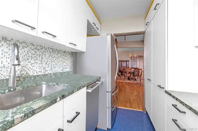 a view of a kitchen cabinets and a wooden floor