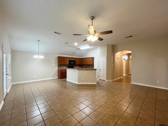 a view of a kitchen with a sink cabinets and a window