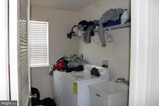 a bathroom with a sink and a window
