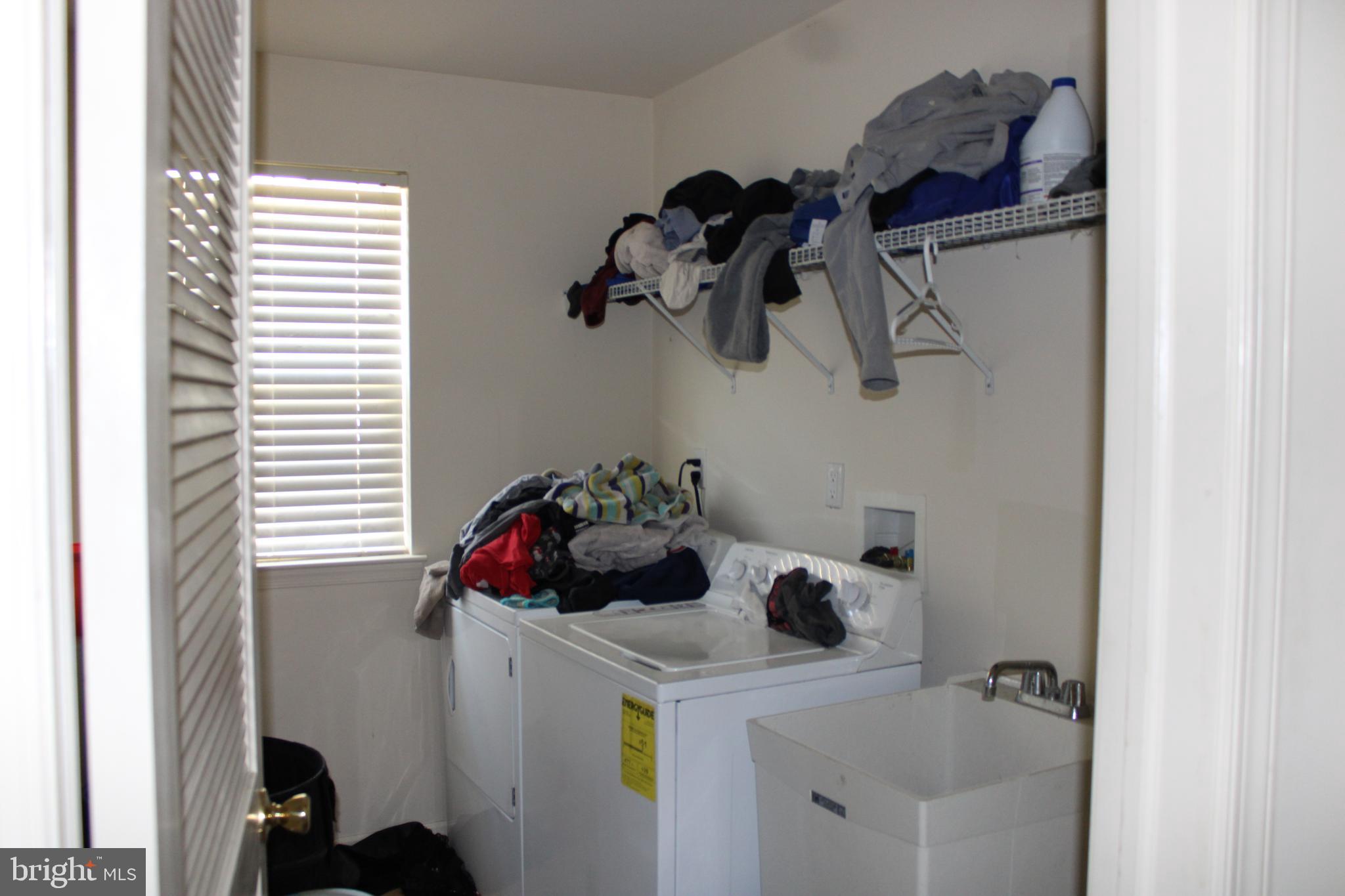 107 Ellis Street Glassboro, NJ 08028 - Photo 8 of 16 a bathroom with a sink and a window