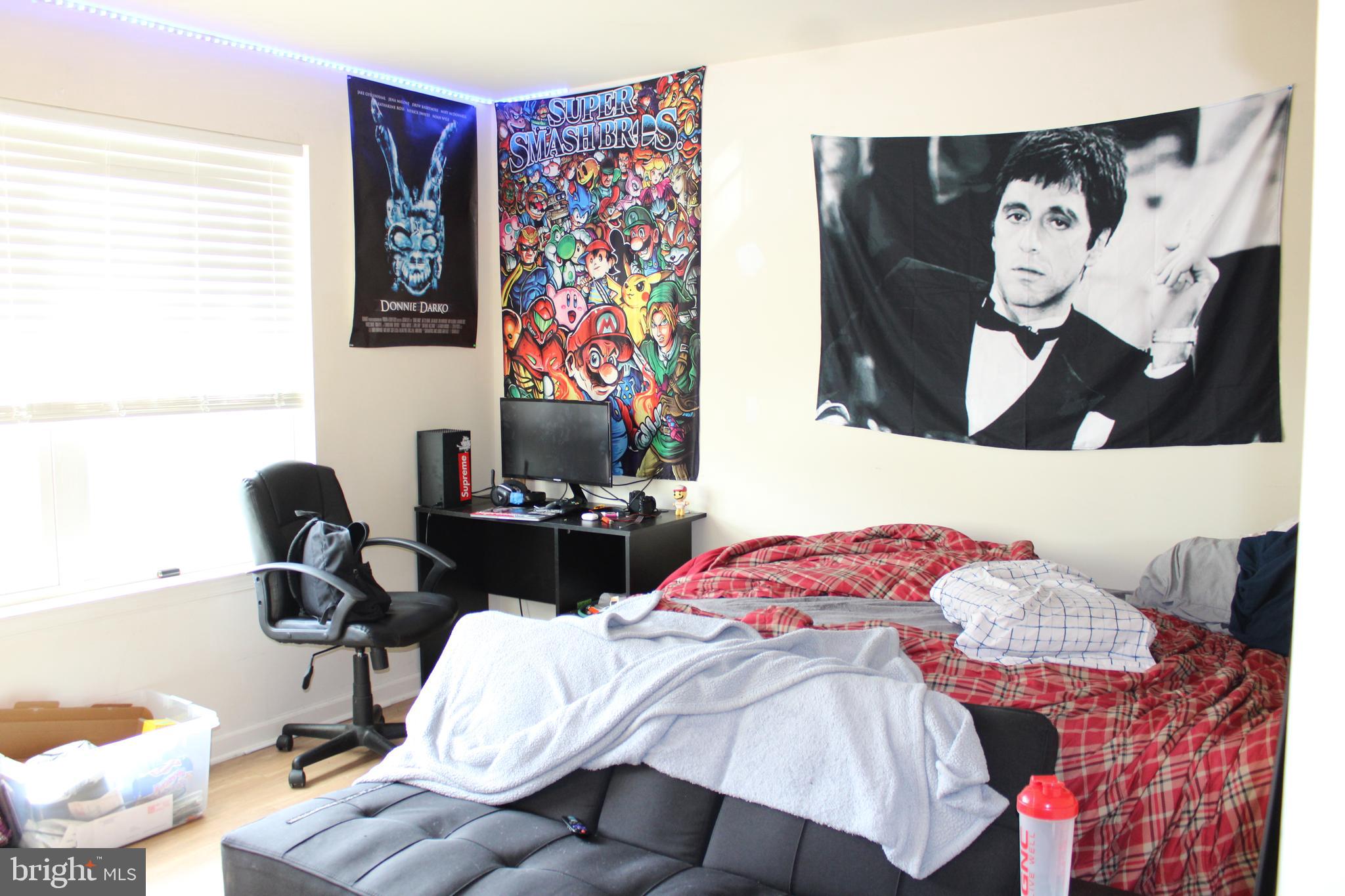 107 Ellis Street Glassboro, NJ 08028 - Photo 10 of 16 a bedroom with a bed and furniture