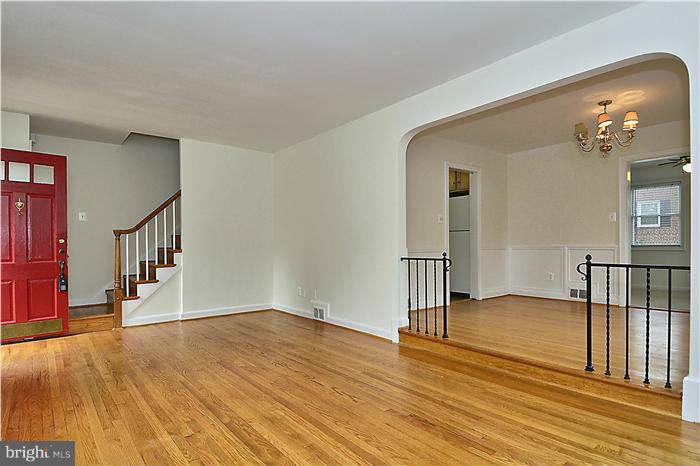 505 Lanark Way Silver Spring, MD 20901 - Photo 6 of 30 a view of empty room with wooden floor
