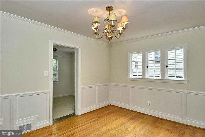 505 Lanark Way Silver Spring, MD 20901 - Photo 7 of 30 wooden floor in an empty room with a window