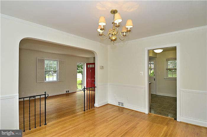 505 Lanark Way Silver Spring, MD 20901 - Photo 8 of 30 wooden floor in an empty room with a window