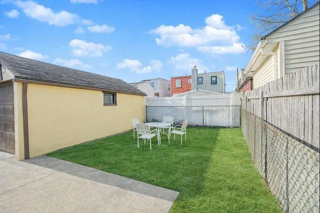 a view of a house with backyard and porch