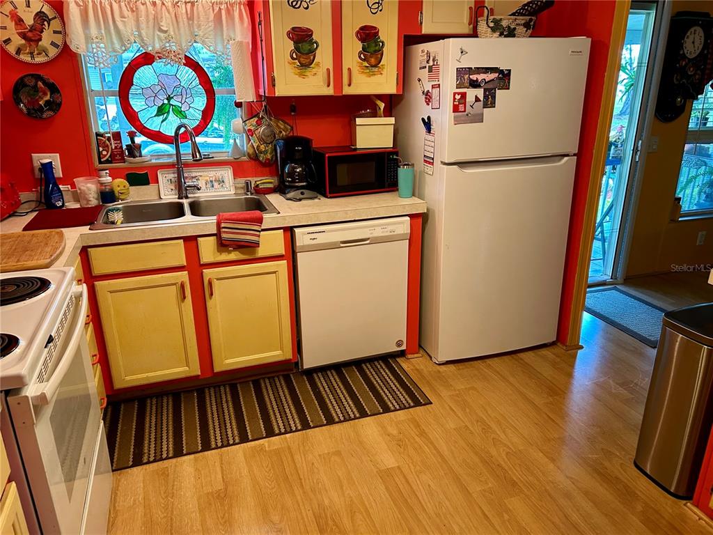 25646 Bass Road Astor, FL 32102 - Photo 24 of 48 a view of storage and utility room with washer and dryer