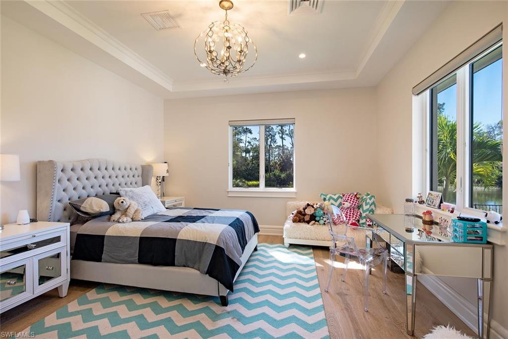 16044 Trebbio Way Naples, FL 34110 - Photo 11 of 33 a bedroom with a bed and a window