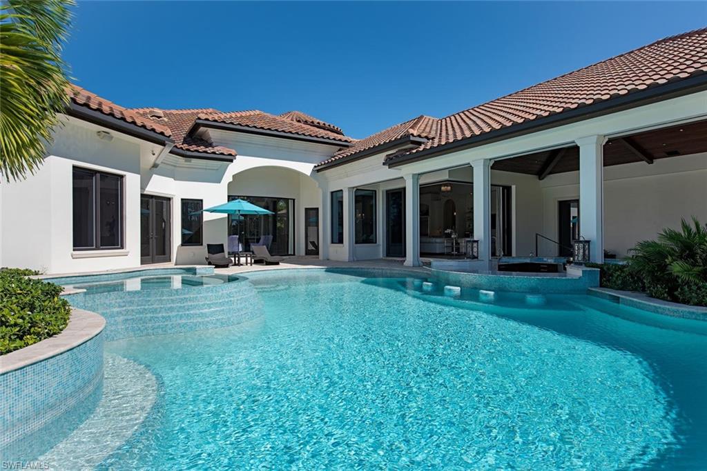 16044 Trebbio Way Naples, FL 34110 - Photo 19 of 33 a view of a house with backyard porch and garden