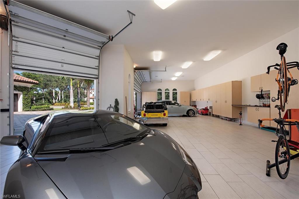 16044 Trebbio Way Naples, FL 34110 - Photo 22 of 33 a room with gym equipment and a large window