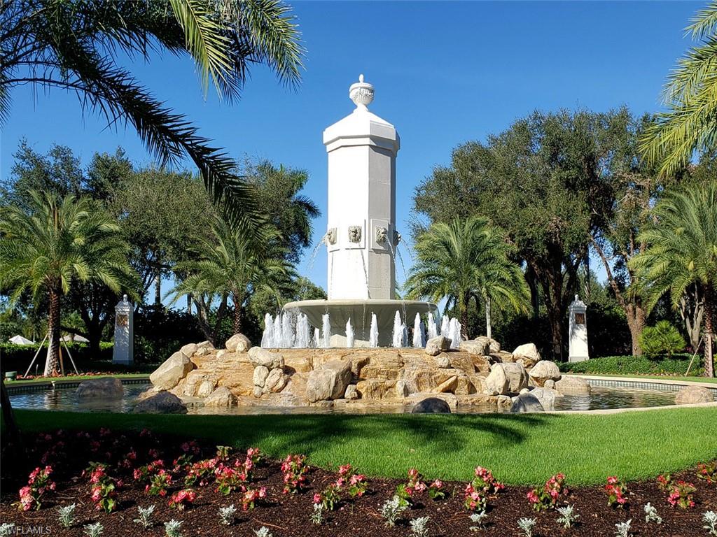 16044 Trebbio Way Naples, FL 34110 - Photo 25 of 33 a front view of a house with garden