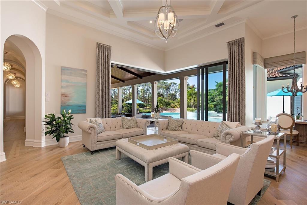 16044 Trebbio Way Naples, FL 34110 - Photo 5 of 33 a living room with furniture and a large window