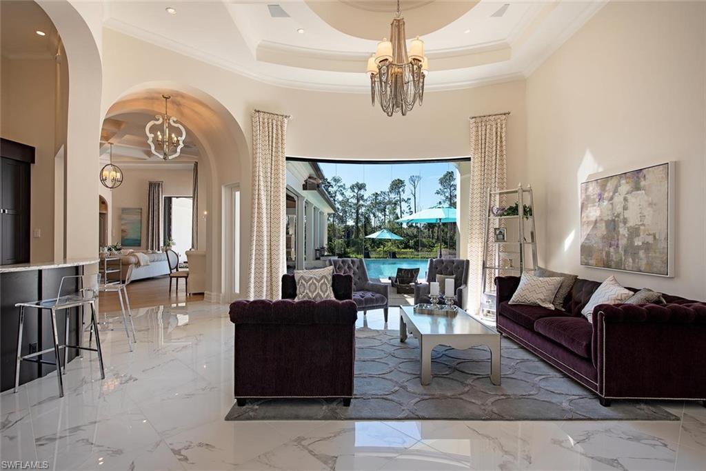 16044 Trebbio Way Naples, FL 34110 - Photo 6 of 33 a living room with furniture and a large window