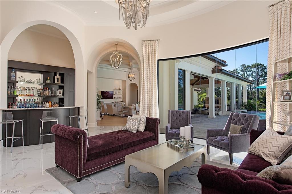 16044 Trebbio Way Naples, FL 34110 - Photo 7 of 33 a living room with furniture
