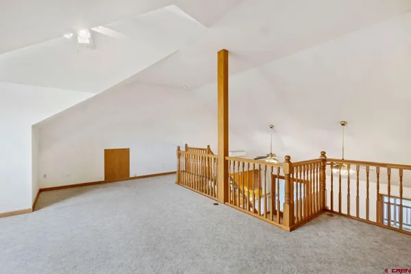 a view of a balcony with wooden floor