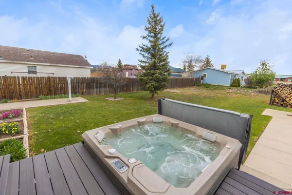 a view of room with window and ceiling fan
