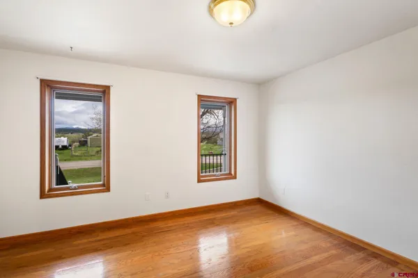 a view of a room with furniture and a ceiling fan