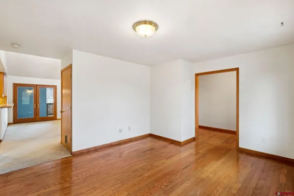 a view of a room with white walls