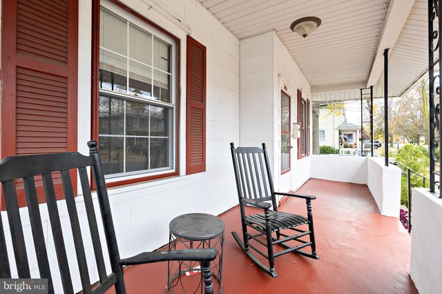 a view of a chairs and table in the balcony