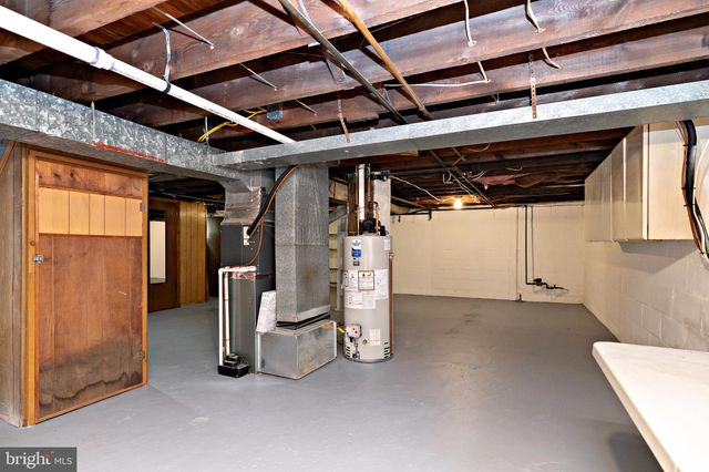 a view of a room with wooden walls