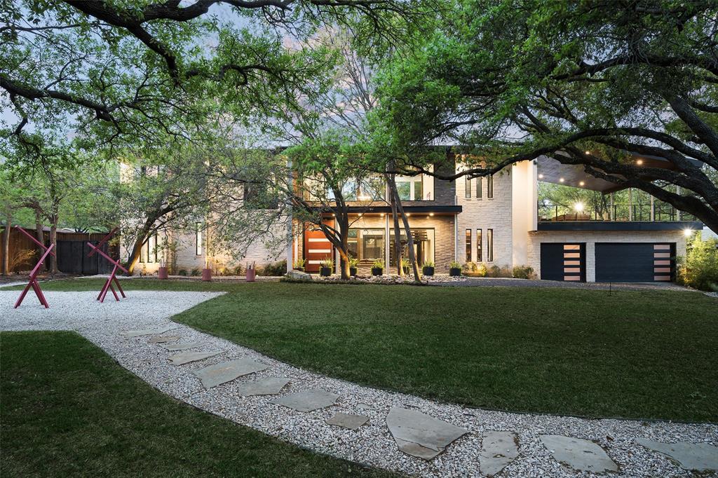 6766 Northaven Road Dallas, TX 75230 - Photo 1 of 40 a view of a backyard with a garden