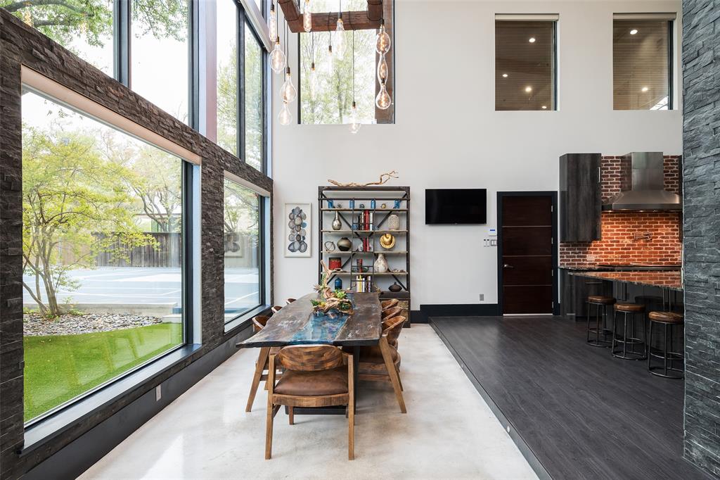 6766 Northaven Road Dallas, TX 75230 - Photo 13 of 40 a living room with furniture and large windows