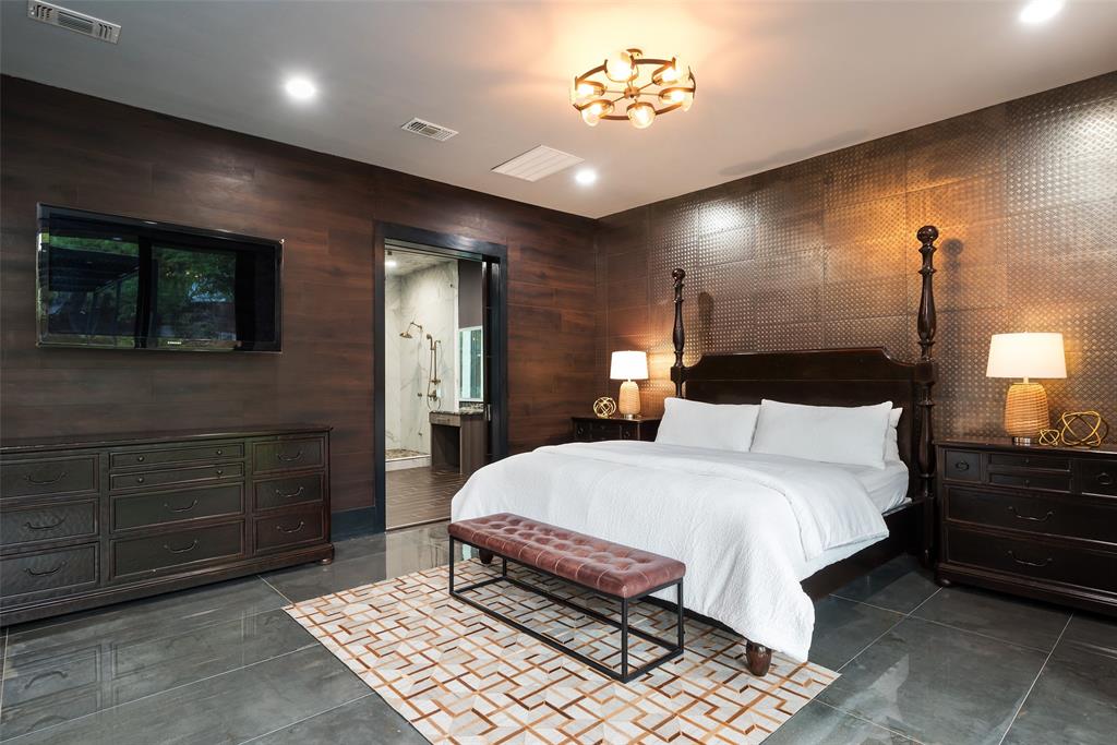 6766 Northaven Road Dallas, TX 75230 - Photo 19 of 40 a bedroom with a bed and a mirror