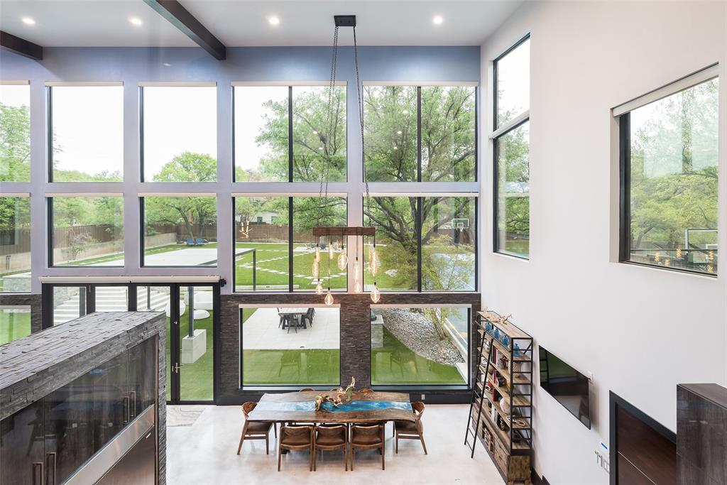 6766 Northaven Road Dallas, TX 75230 - Photo 28 of 40 a view of a dining room with furniture window and outside view