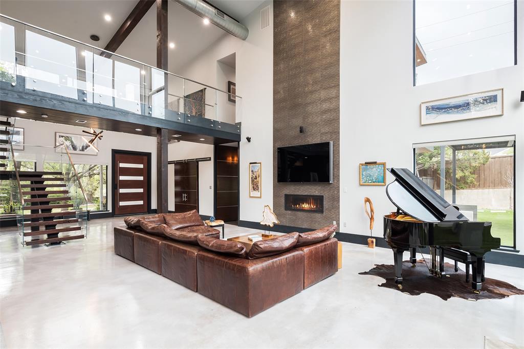 6766 Northaven Road Dallas, TX 75230 - Photo 7 of 40 a living room with furniture and a flat screen tv