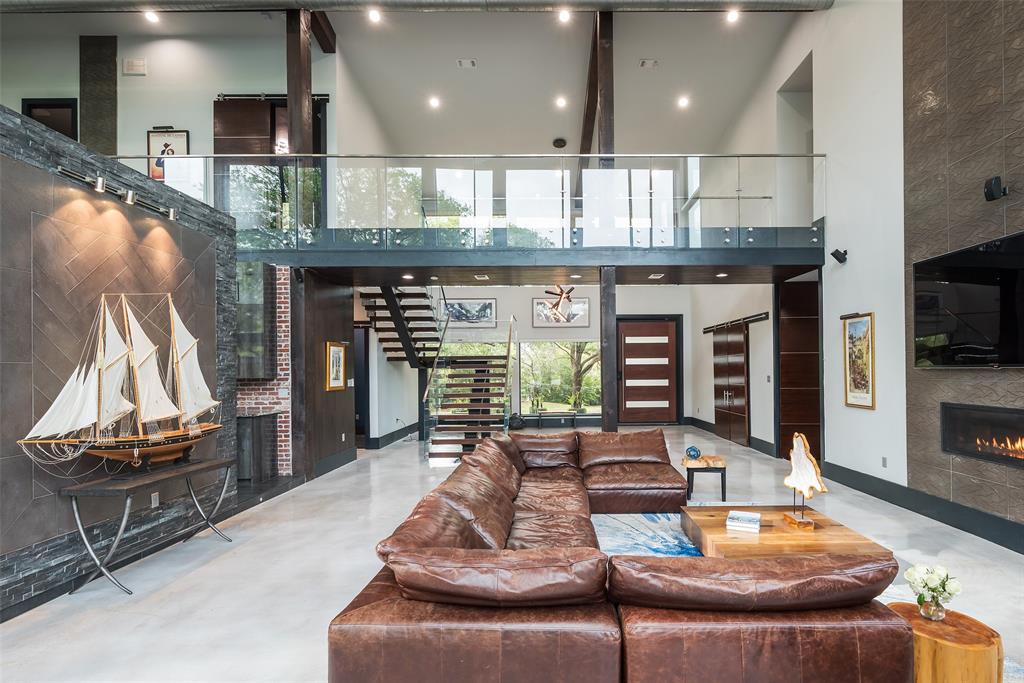 6766 Northaven Road Dallas, TX 75230 - Photo 8 of 40 a living room with furniture and a fireplace