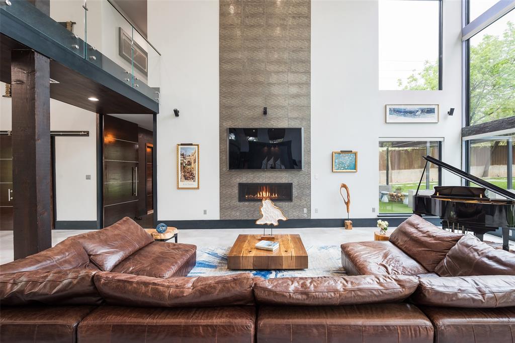 6766 Northaven Road Dallas, TX 75230 - Photo 10 of 40 a living room with furniture and a flat screen tv