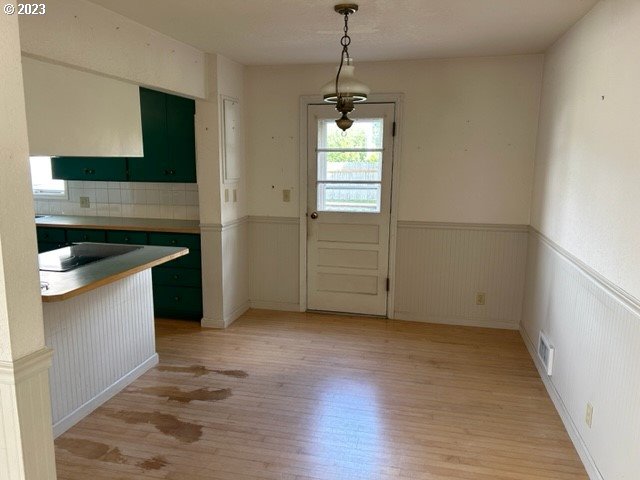 636 Laurel Street Florence, OR 97439 - Photo 14 of 21 a view of empty room with wooden floor and fan