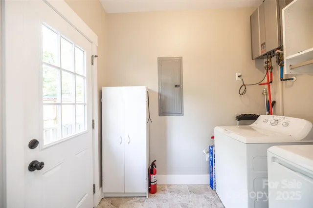 a bathroom with a sink vanity and windows
