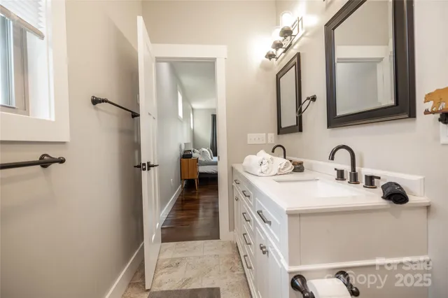 a bathroom with a double vanity sink and a mirror