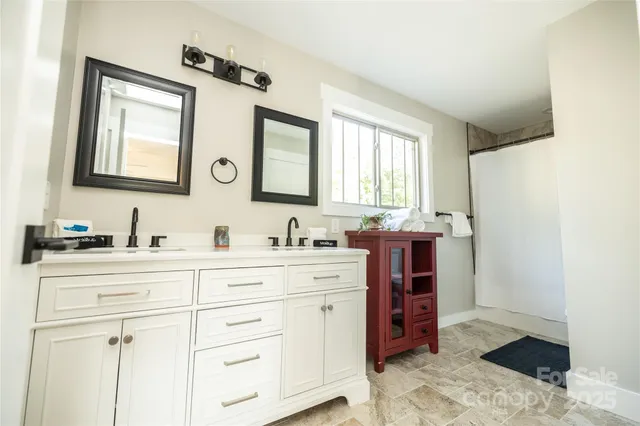 a bathroom with a sink a vanity and a mirror