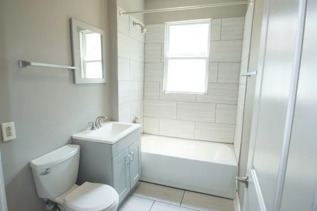 a bathroom with a toilet sink and bathtub