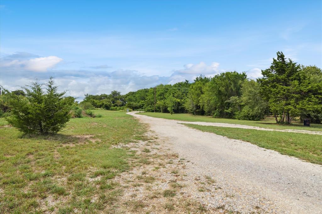 403 Polk Road Bowie, TX 76230 - Photo 32 of 36 a view of a field with an trees