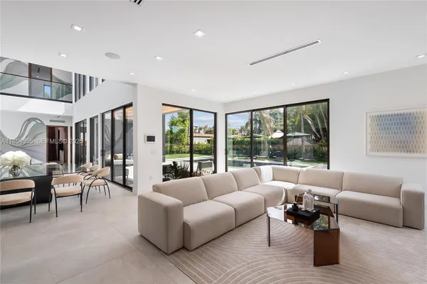 a view of a swimming pool with a lounge chairs