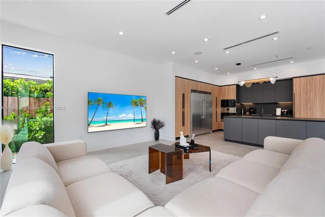 a view of a patio with a table and chairs under an umbrella