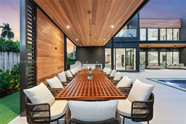 a dining room with furniture and wooden floor