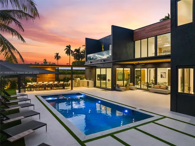 a view of a patio with swimming pool table and chairs