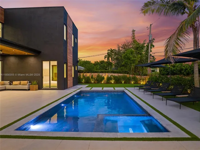 a bathroom with a bathtub sink and mirror