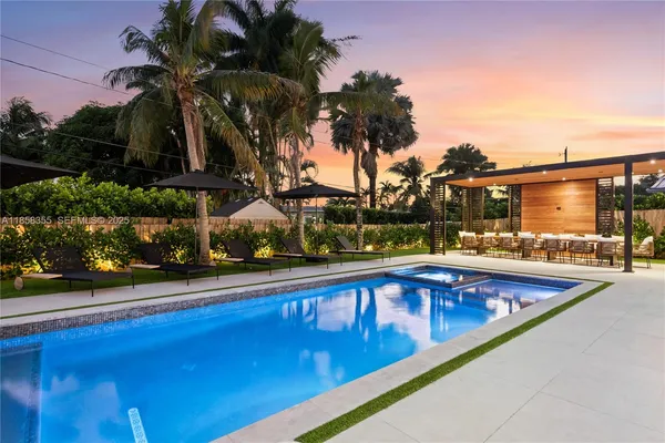 a bathroom with a bathtub sink and mirror