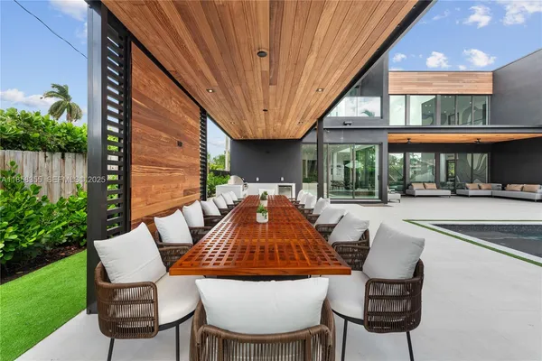 a bathroom with a tub sink shower and mirror