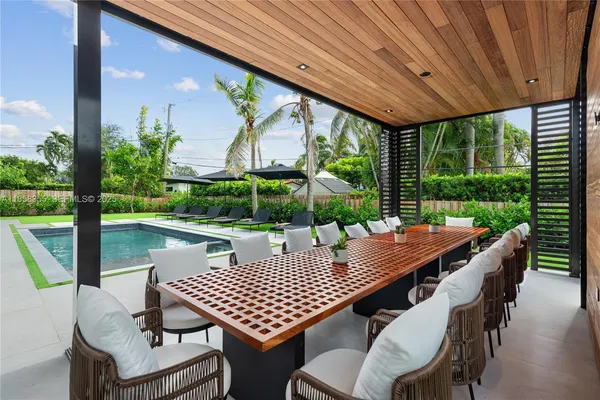 a bedroom with a large bed and a couch