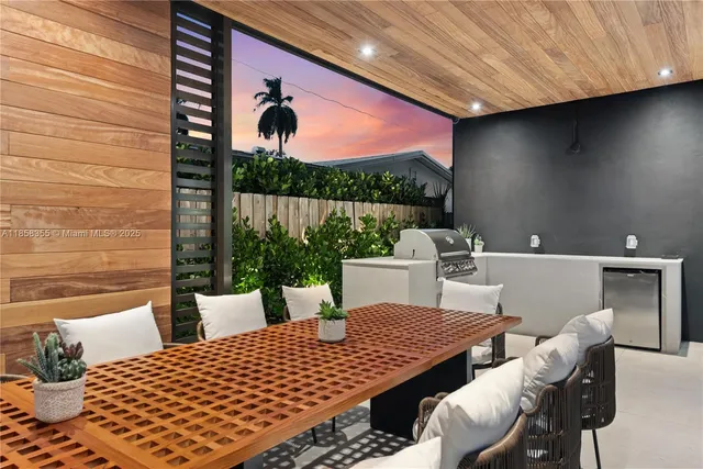 a bathroom with a bathtub shower sink mirror and toilet