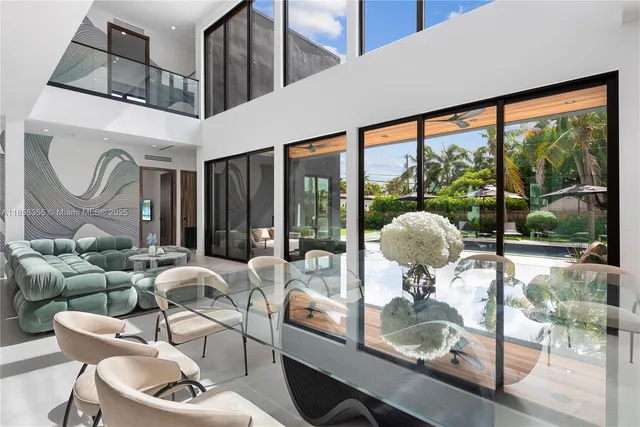 a bedroom with a large bed and a large window