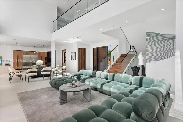 a bedroom with a large bed and a large window